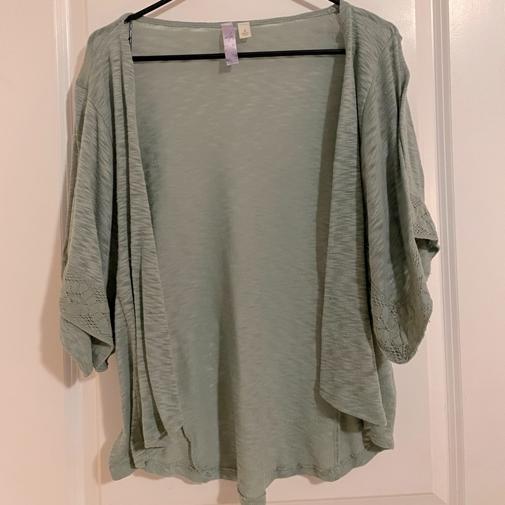 Francesca’s earthy green cardigan